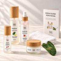 Rosy Lana Fresh Glow Mini Facial with skincare, a folded white face towel, green jade gua sha and ritual guide on a light background